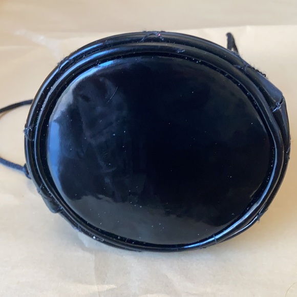 11:01  - 3/$25 Bundle Only GUESS Patent Drawstring Pouch - Picture 8 of 11